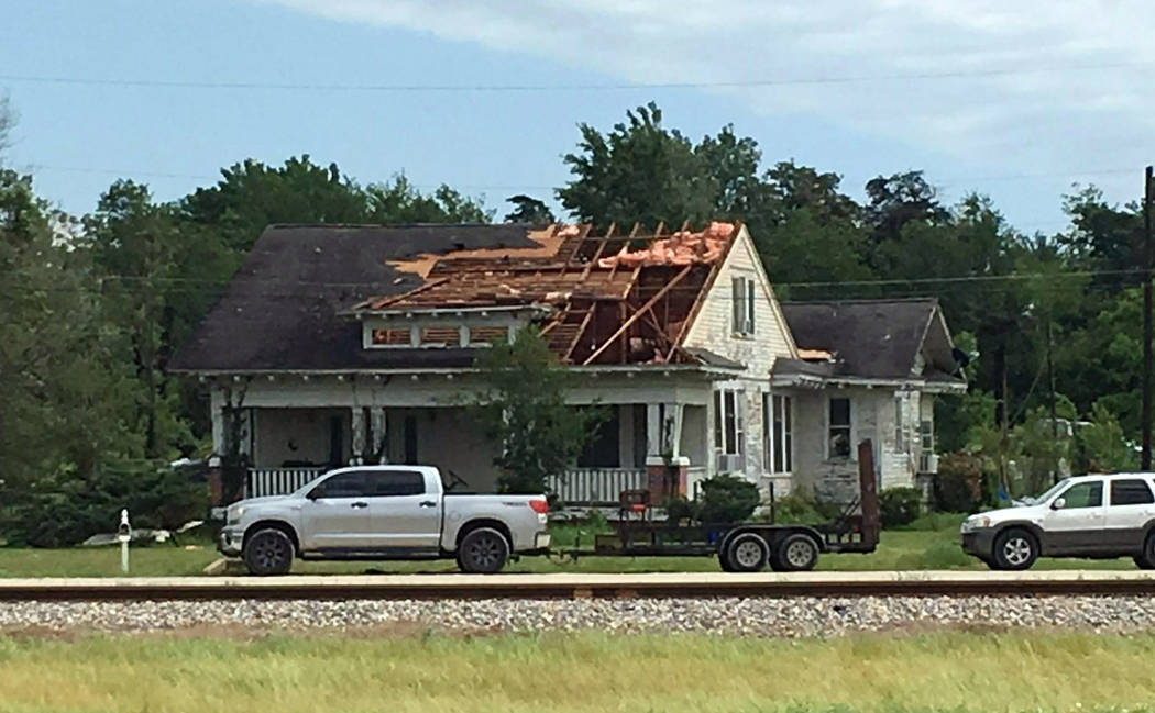 A roof is torn off a home following a suspected tornado, Saturday, April 13, 2019 in Franklin, ...