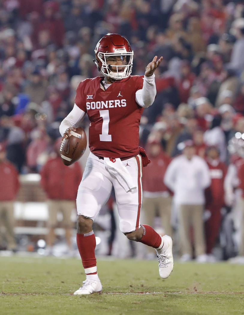 Oklahoma quarterback Kyler Murray (1) gestures to his team during a play against Kansas during ...