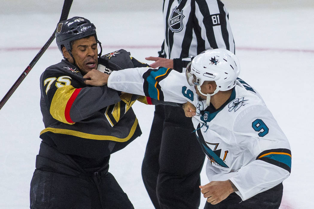 Golden Knights right wing Ryan Reaves (75) fights with San Jose Sharks left wing Evander Kane ( ...