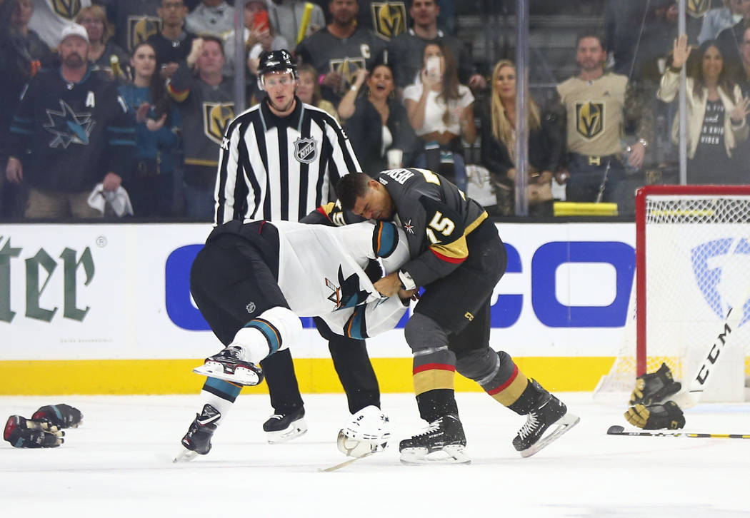 Golden Knights right wing Ryan Reaves (75) fights San Jose Sharks left wing Evander Kane (9) du ...