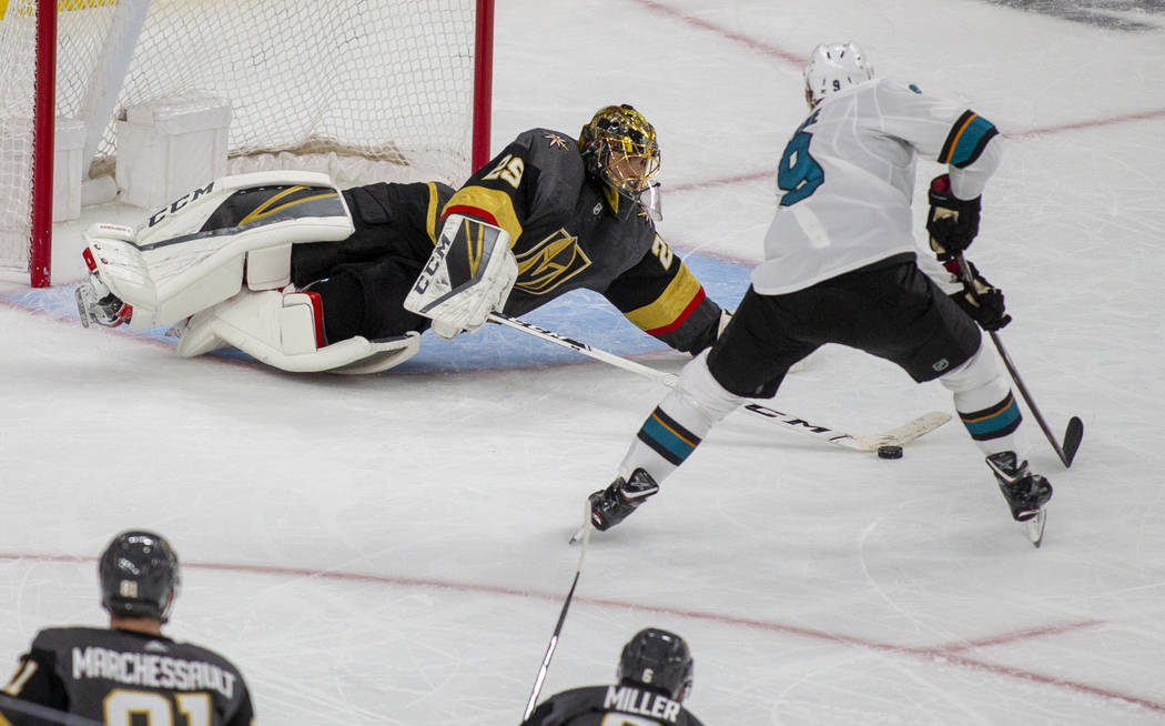 Golden Knights goaltender Marc-Andre Fleury (29) saves a shot on goal by San Jose Sharks left w ...