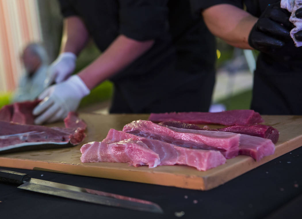 Bluefin tuna is prepare by chefs from Naked Fish during UNLVino's Sake Fever event at Red Rock ...