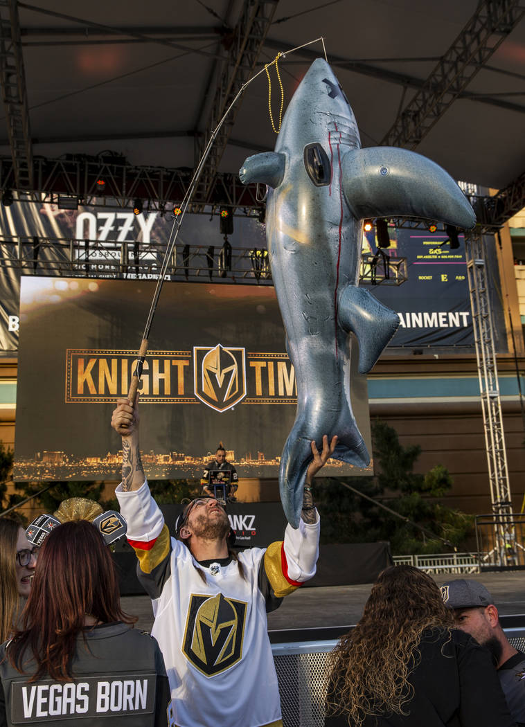 Tom Wright fishes for shark before the start of Game 3 of an NHL Western Conference quarterfina ...