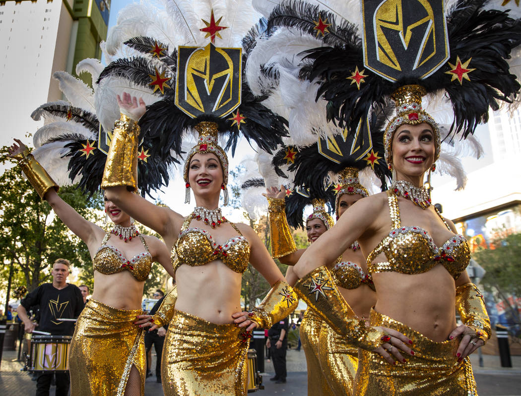 Show girls join the parade into the plaza before the start of Game 3 of an NHL Western Conferen ...