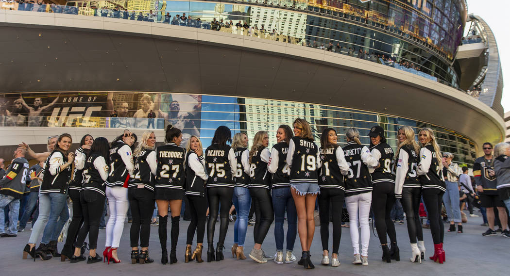 The women of the Golden Knights stand together before the start of Game 3 of an NHL Western Con ...