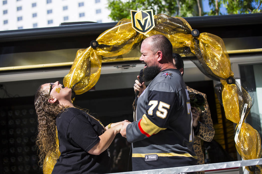 Crystal Mensch, left, and Andy Mensch, both of Las Vegas, cheer during a vow renewal ceremony h ...