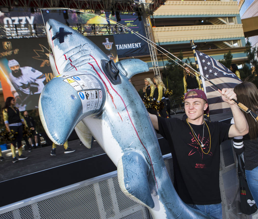 Golden Knights fan Roddy Tukis holds up an inflatable shark before the start of Game 3 of an NH ...