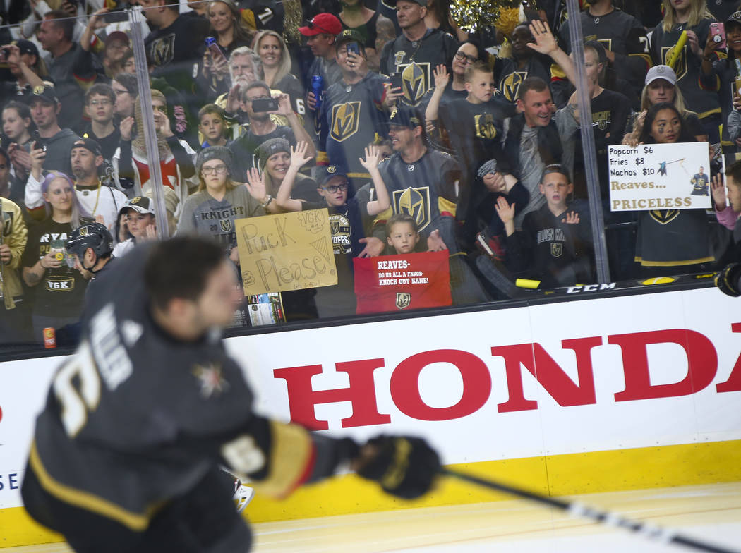 Golden Knights fans watch as players warm up before Game 3 of an NHL Western Conference quarter ...