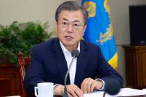 South Korean President Moon Jae-in speaks during a meeting with his aids at the presidential Bl ...