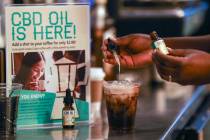 A worker adds cannabidiol (CBD) to a drink at a coffee shop in Fort Lauderdale, Fla. on Jan. 4, ...