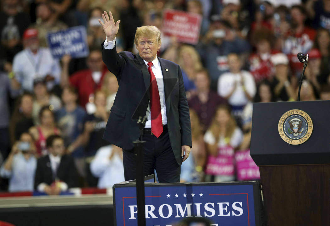 President Donald Trump waves to the crowd after speaking at a campaign rally, Wednesday, June 2 ...