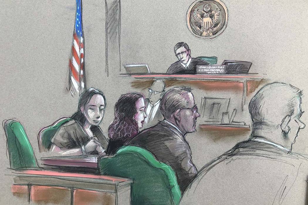 In this artist sketch, a Chinese woman, Yujing Zhang, left, listens to a hearing Monday, April ...