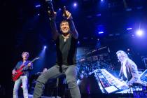 Ross Valory, Arnel Pineda and Jonathan Cain of Journey are shown during the band's opening nigh ...