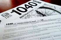 This Feb. 13, 2019, file photo shows multiple forms printed from the Internal Revenue Service w ...