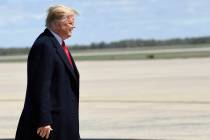 President Donald Trump walks towards the steps of Air Force One at Andrews Air Force Base in Md ...