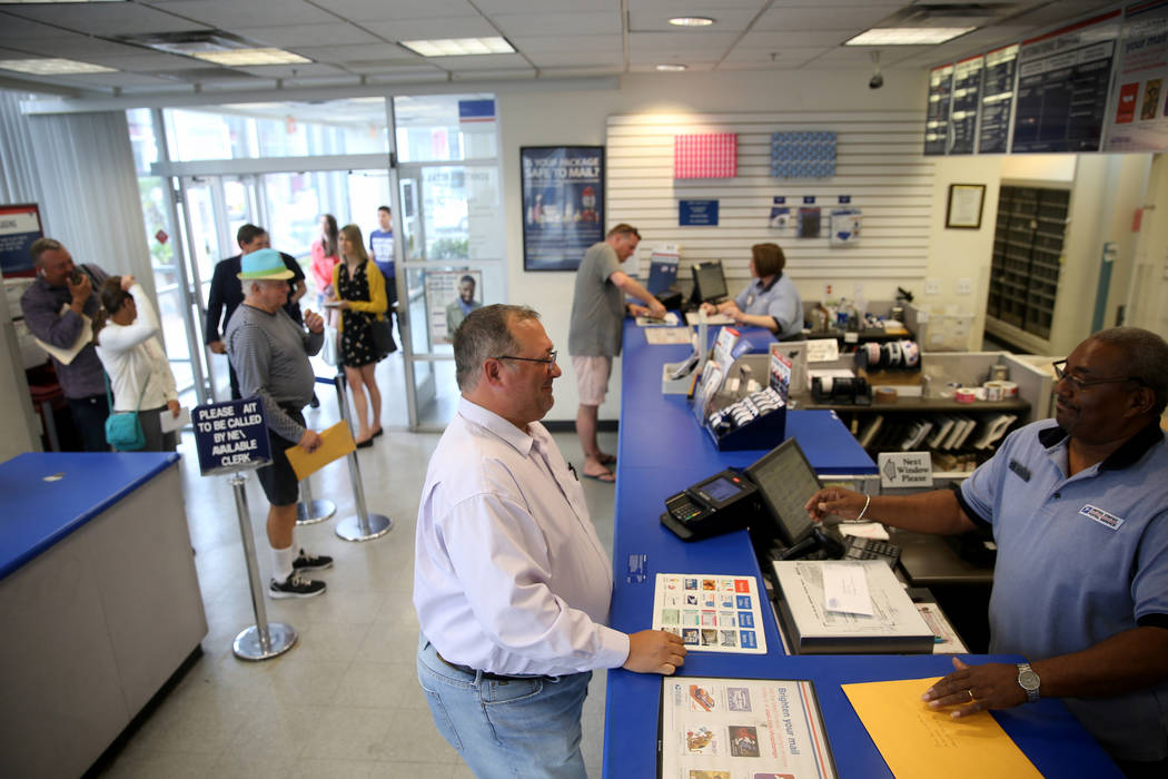 Jeffrey Balcom, 44, of Las Vegas, mails his taxes with David, who declined to give his last nam ...