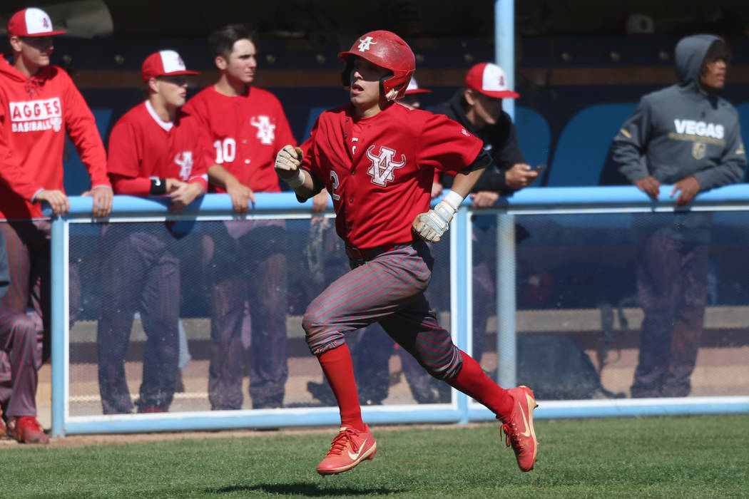 Arbor View's Nicholas Cornman (2) runs home for a score against Carson in the baseball game at ...
