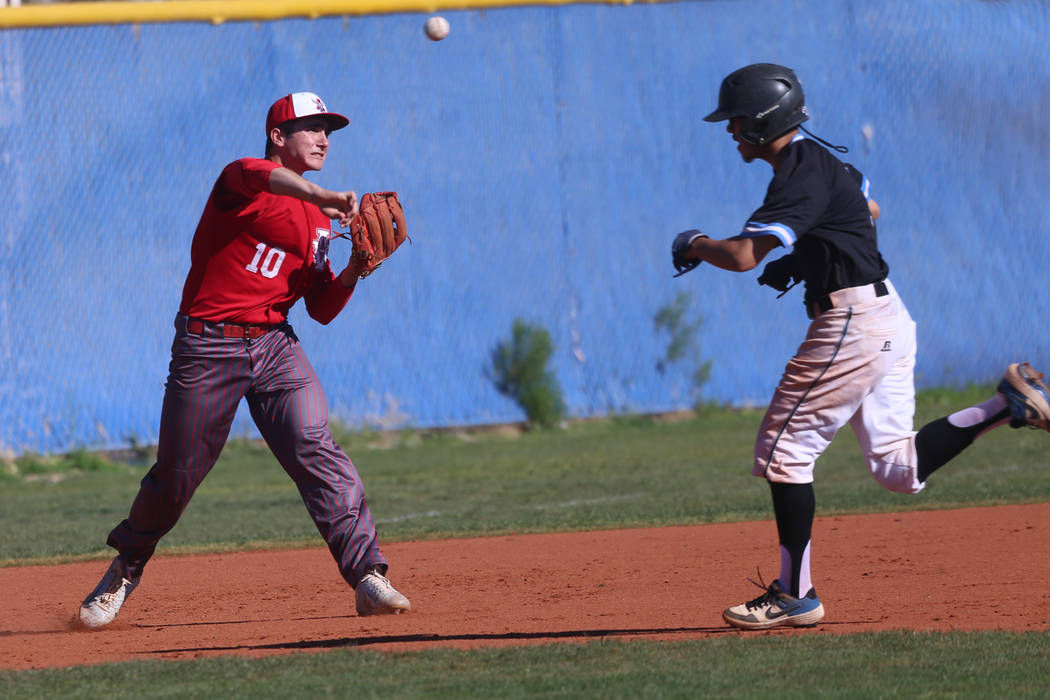 Arbow View's Dillon Jones (10) throws to second base for a double out play against Carson in th ...