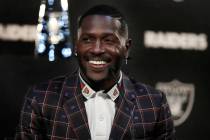 Raiders wide receiver Antonio Brown smiles during the NFL football team's news conference Wedne ...