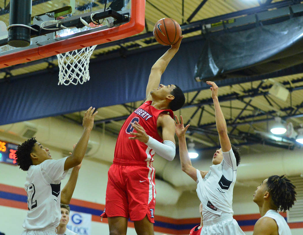 Liberty's Julian Strawther (0) rebounds the ball in the second quarter of the game between Libe ...