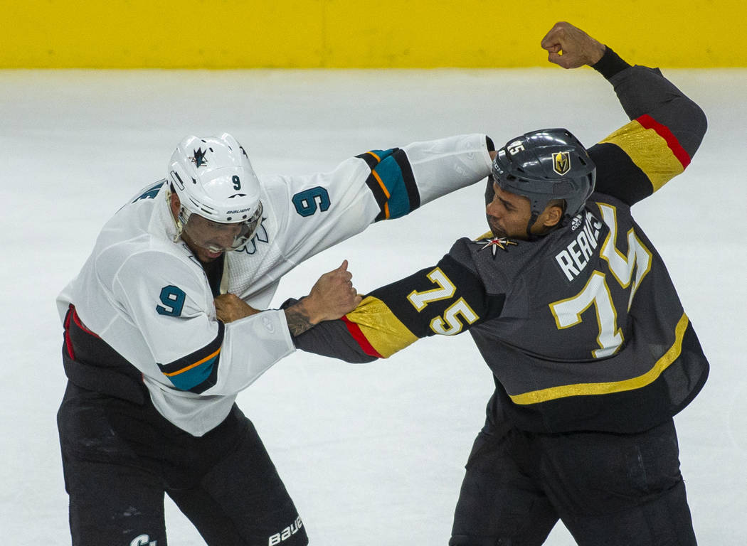 San Jose Sharks left wing Evander Kane (9) fights with Golden Knights right wing Ryan Reaves (7 ...
