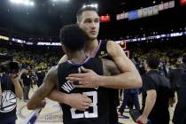 Los Angeles Clippers guard Lou Williams, left, and forward Danilo Gallinari celebrate after def ...