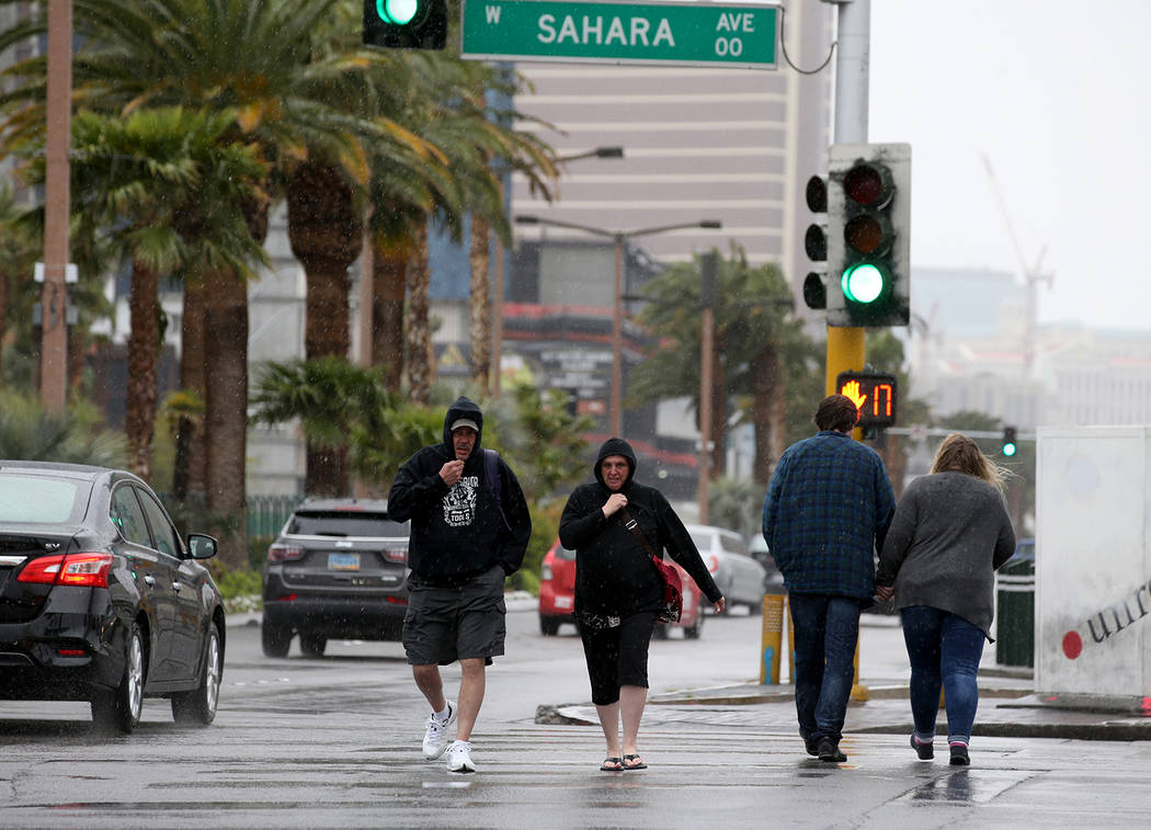 Keith and Kimberly Spahr, of Cincinnati, Ohio, cross Sahara Avenue at Las Vegas Boulevard in La ...