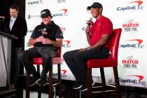 Phil Mickelson, second left, and Tiger Woods take questions during a press conference at Shadow ...