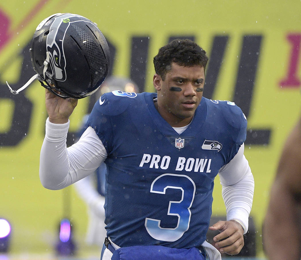 In this Jan. 27, 2019, file photo, NFC quarterback Russell Wilson of the Seattle Seahawks runs ...