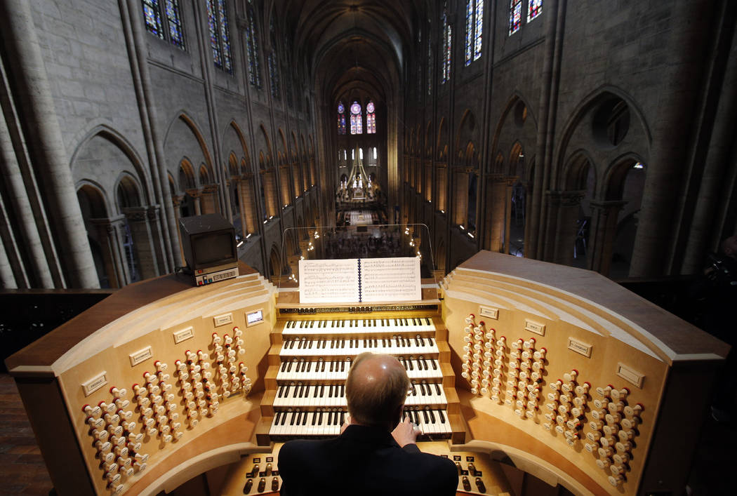 Philippe Lefebvre, 64, plays the organ May 2, 2013, at Notre Dame cathedral in Paris. (AP Phot ...