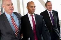 Former Minneapolis police officer Mohamed Noor, center, leaves the Hennepin County Government C ...