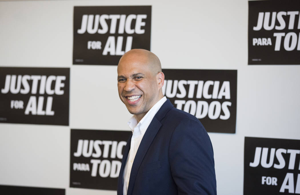 Democratic presidential candidate Sen. Cory Booker, D-N.J., shares a laugh with the crowd durin ...