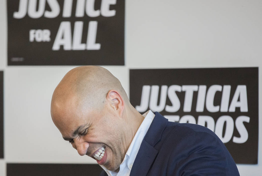 Democratic presidential candidate Sen. Cory Booker, D-N.J., shares a laugh with the crowd durin ...