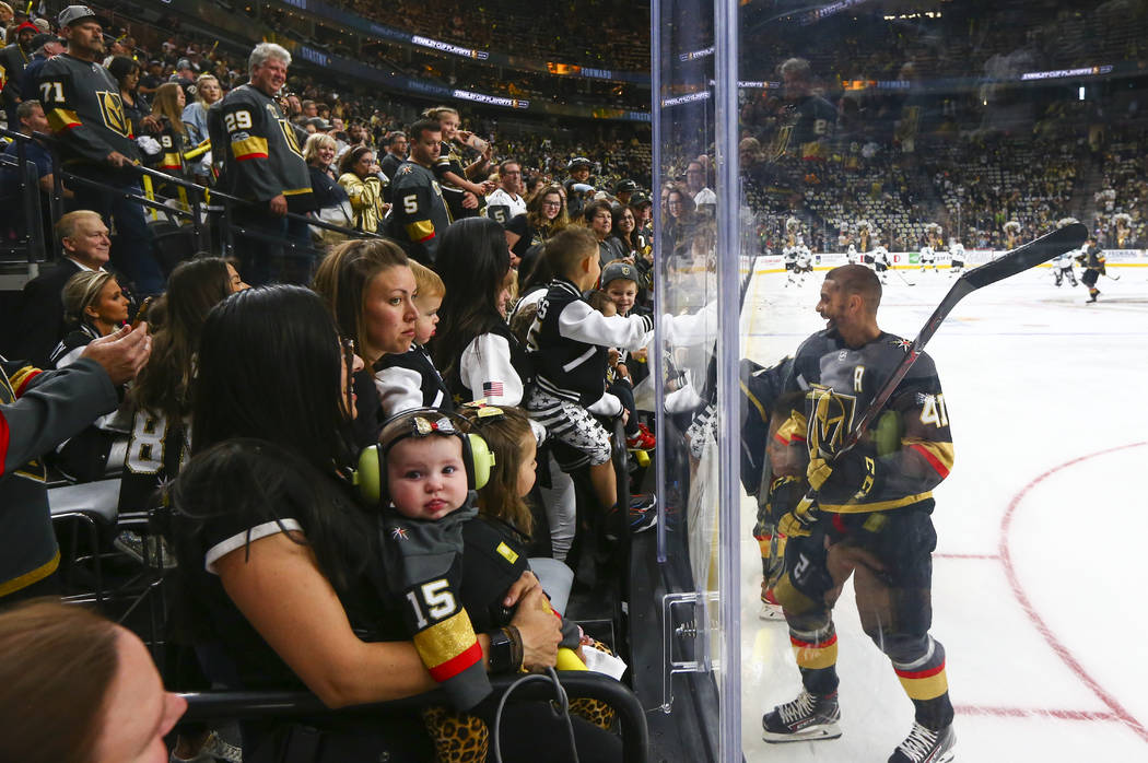 Golden Knights center Pierre-Edouard Bellemare (41) visits with family and friends while warmin ...