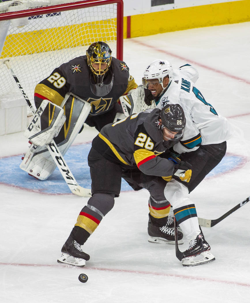 Golden Knights center Paul Stastny (26) defends the net from San Jose Sharks left wing Evander ...