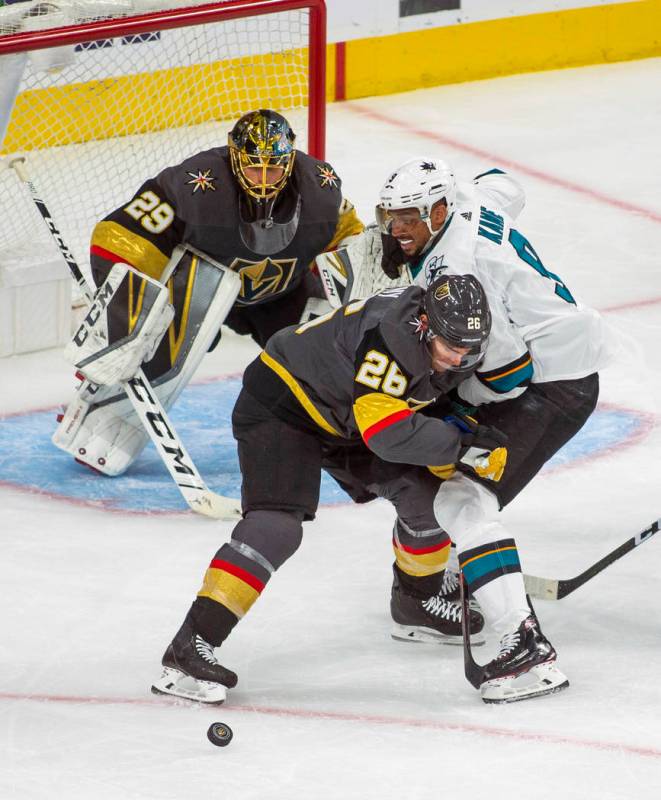 Golden Knights center Paul Stastny (26) defends the net from San Jose Sharks left wing Evander ...