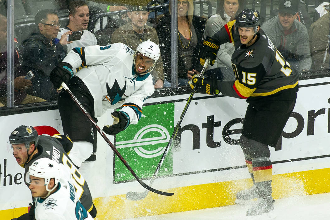 San Jose Sharks left wing Evander Kane (9) crashes the boards on a drive with Golden Knights de ...