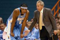 FILE - In this Sunday, Oct. 19, 2003, file photo, Denver Nuggets' Carmelo Anthony, left, receiv ...