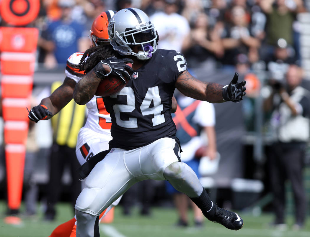 Oakland Raiders running back Marshawn Lynch (24) looks to avoid a tackle during the first half ...