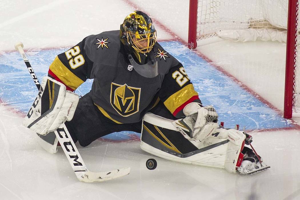 Golden Knights goaltender Marc-Andre Fleury (29) makes a stop during the first period of Game 4 ...
