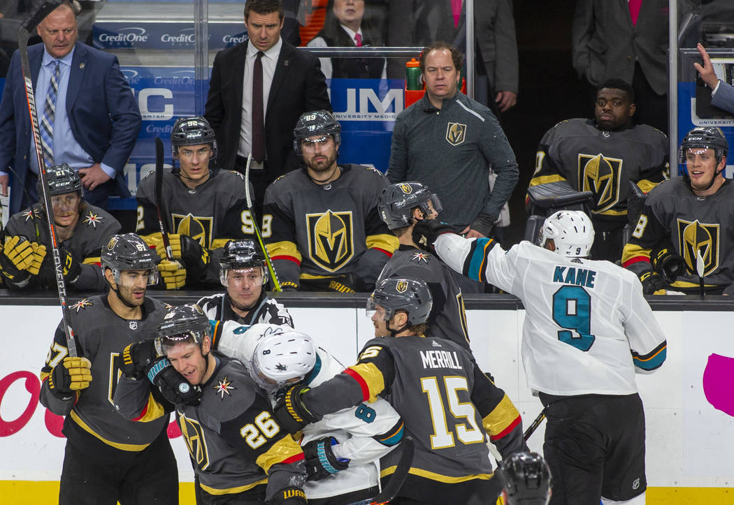 San Jose's Evander Kane lands a straight left to the side of Golden Knights' Colin Miller's fac ...