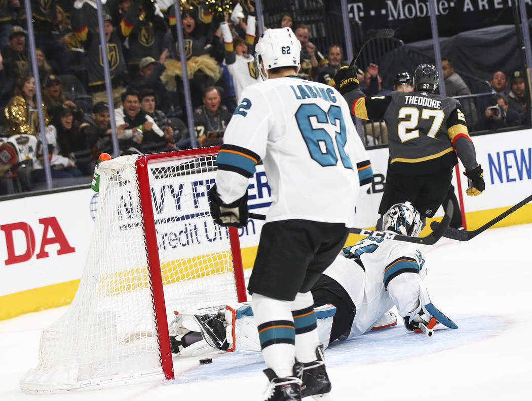 Golden Knights defenseman Shea Theodore (27) scores a goal past San Jose Sharks goaltender Mart ...