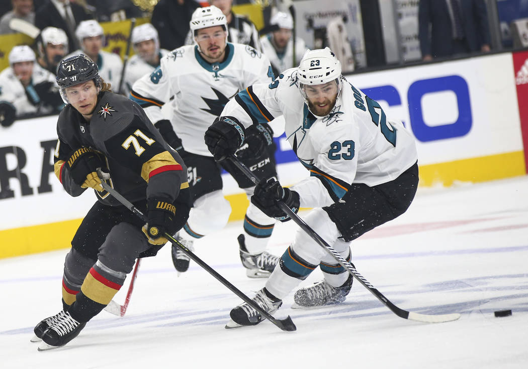 San Jose Sharks right wing Barclay Goodrow (23) skates with the puck under pressure from Golden ...