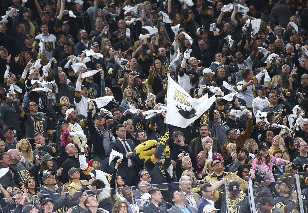 Golden Knights fans, along with mascot Chance, celebrate a goal by Golden Knights defenseman Sh ...