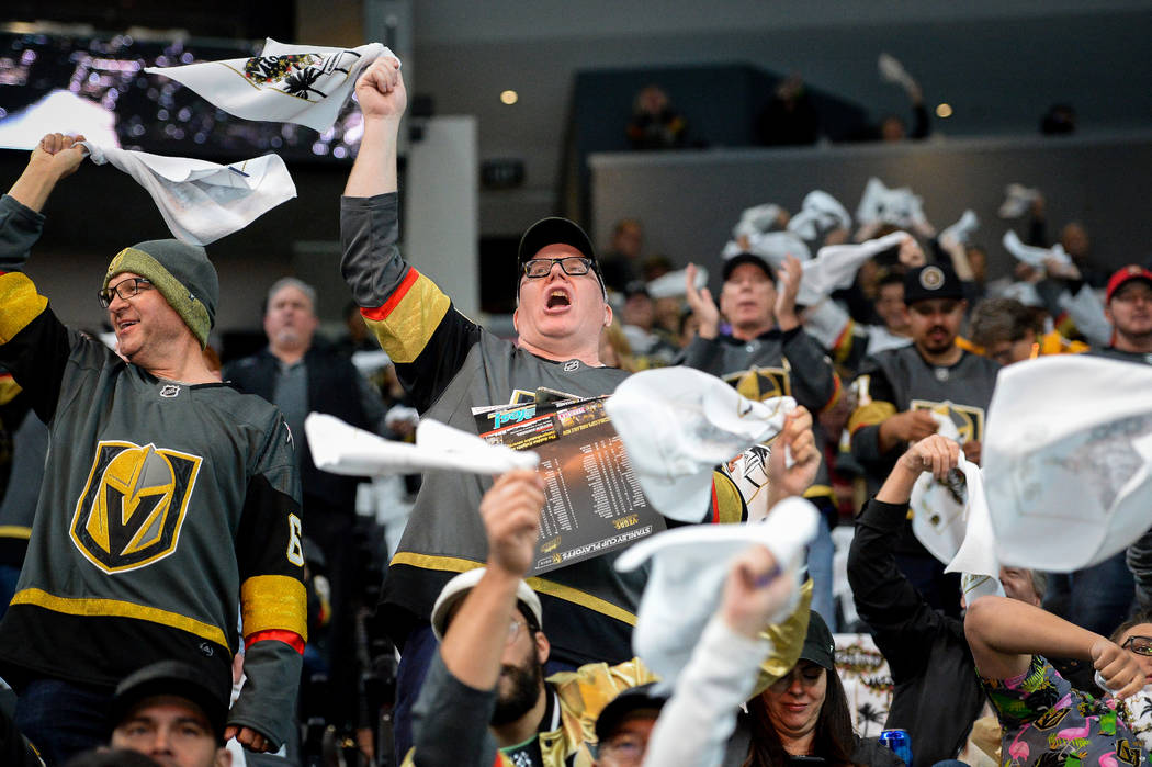 Fans cheer on the Golden Knights as they warm up before they face off against the San Jose Shar ...
