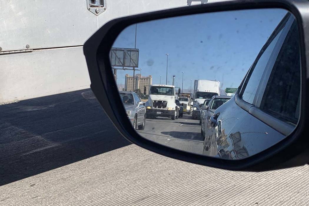 A semitrailer stopped in the middle of Interstate 15 near Charleston Boulevard has slowed traff ...