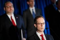 US Attorney Benjamin C. Glassman, of the Southern District of Ohio, speaks beside members of Ap ...