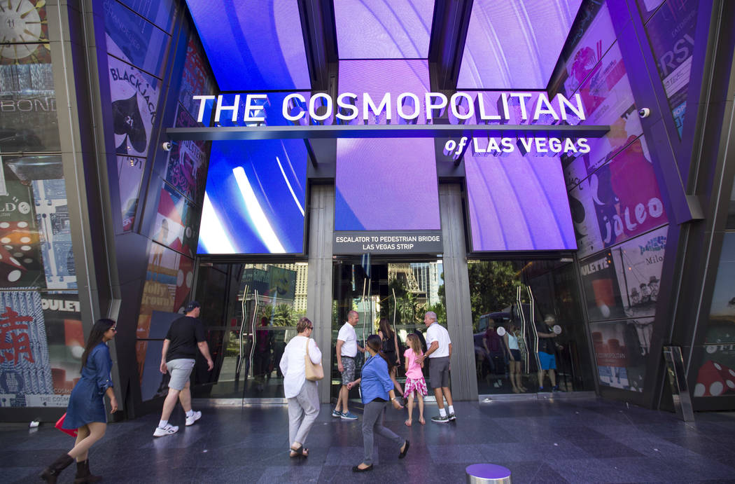 People walk outside The Cosmopolitan of Las Vegas on The Strip, Thursday, May 31, 2018. Richard ...