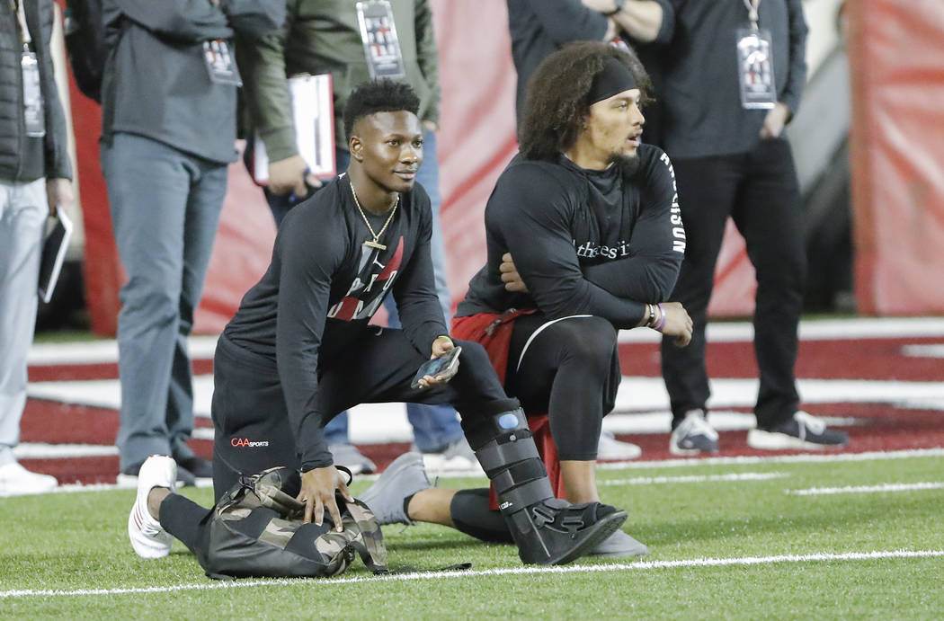 Oklahoma wide receiver Marquise Brown, left, and running back Rodney Anderson watch during the ...