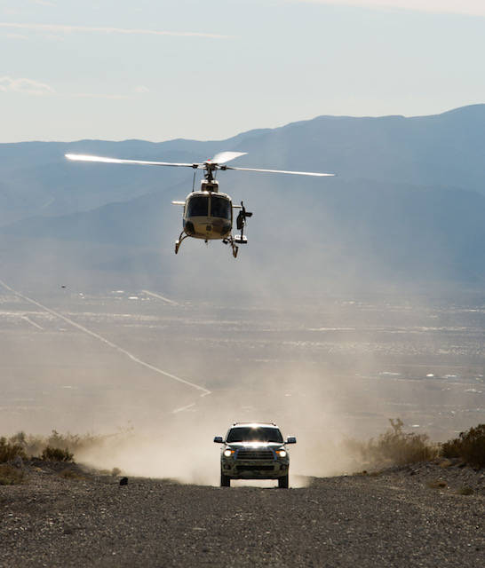 A helicopter and truck at the Gunship Helicopters site in Sandy Valley, Nevada. (courtesy)